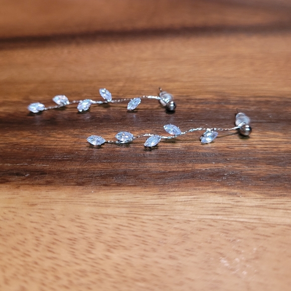 Elegant, simple crystal silver color metal dangle earrings with plastic backing. - Picture 2 of 5